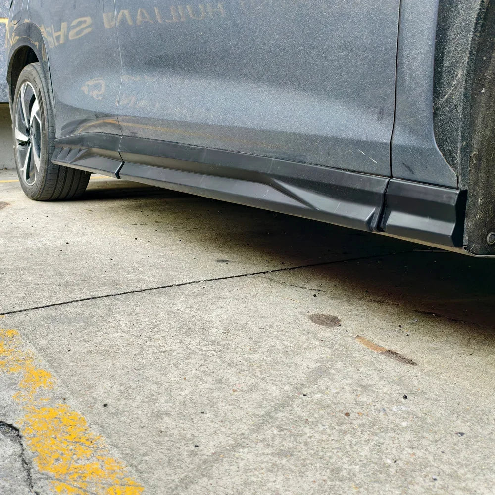 Black matte side skirt protector installed on a grey BYD vehicle for side body protection.