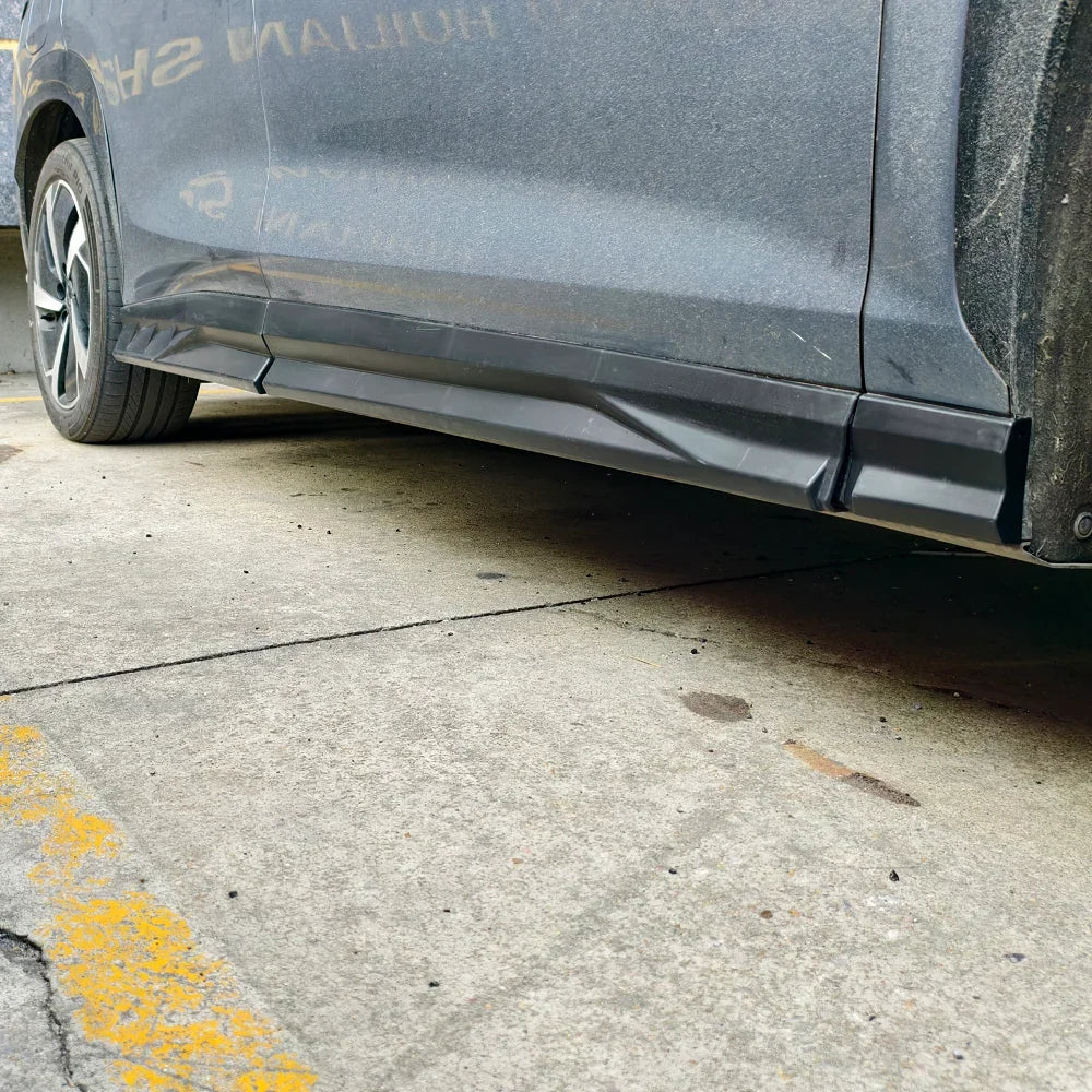 Damaged black side skirt on a grey BYD vehicle showing impact wear and tear.