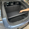 Black custom-fit felt trunk mat for BYD, providing durable cargo protection.