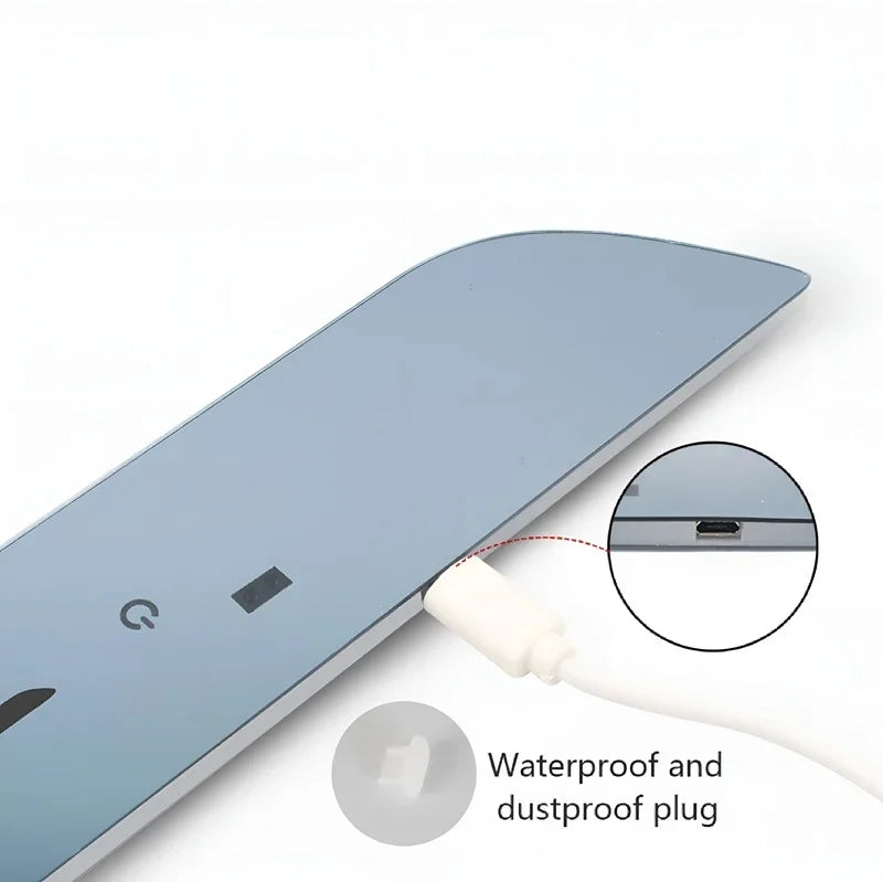 Close-up of a white waterproof and dustproof plug inserted into a blue automotive accessory.