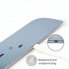 Close-up of a white waterproof and dustproof plug inserted into a blue automotive accessory.
