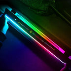 Mercedes-Benz illuminated door sill plate featuring vibrant multi-color LED lighting.
