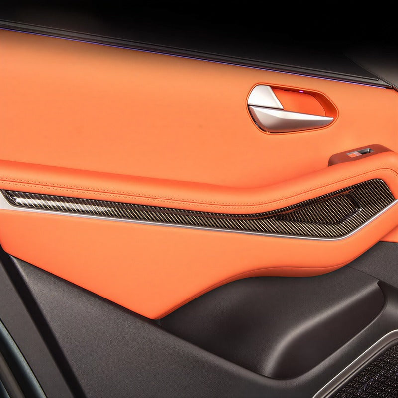 Luxury orange leather car door panel with carbon fiber trim and silver door handle