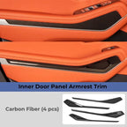 Carbon fiber inner door panel armrest trim set for orange car interior, 4-piece kit.