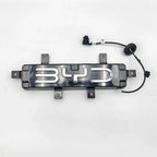 Black BYD illuminated emblem with chrome lettering and integrated wiring harness.