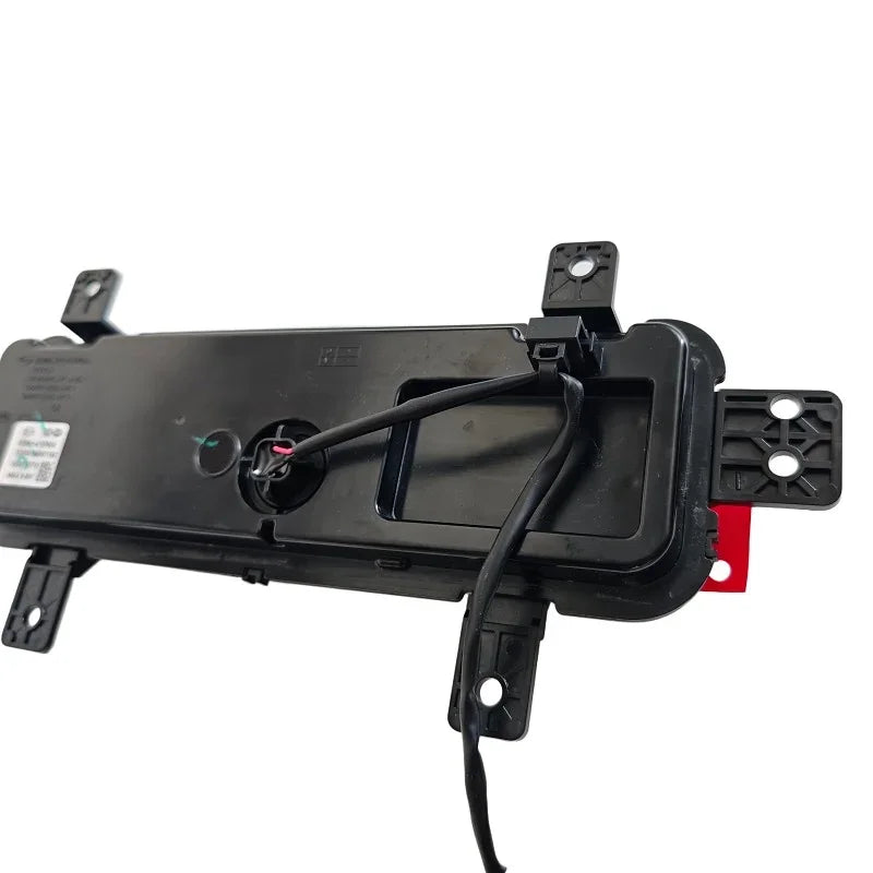 Black durable plastic rear tail light housing with electrical wiring and mounting brackets.