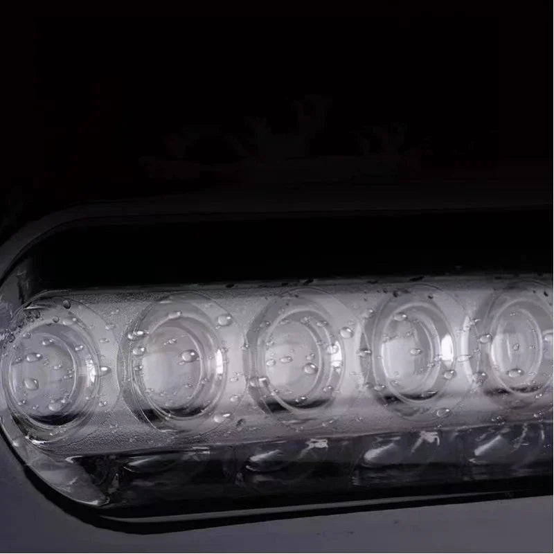 Clear waterproof LED headlight assembly with multi-lens design for enhanced vehicle visibility.