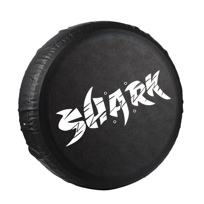 Black textured synthetic leather spare tire cover with white Shark graphic design.