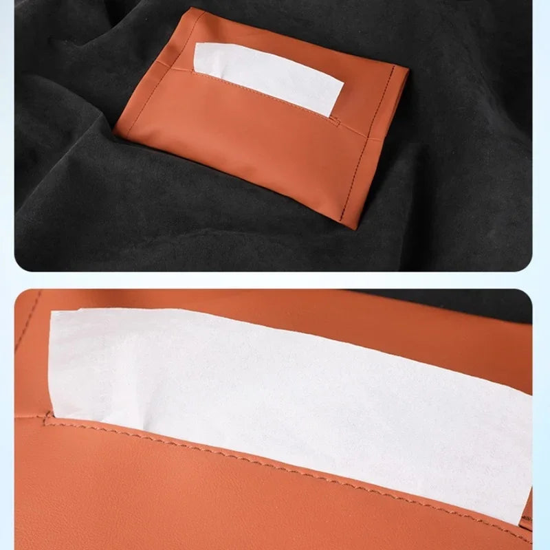 Close-up of a brown leather storage pocket on black car interior fabric.