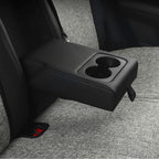 Black leather center armrest with dual cup holders for car interior