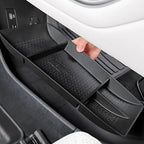 Black textured plastic center console organizer tray for car interior storage