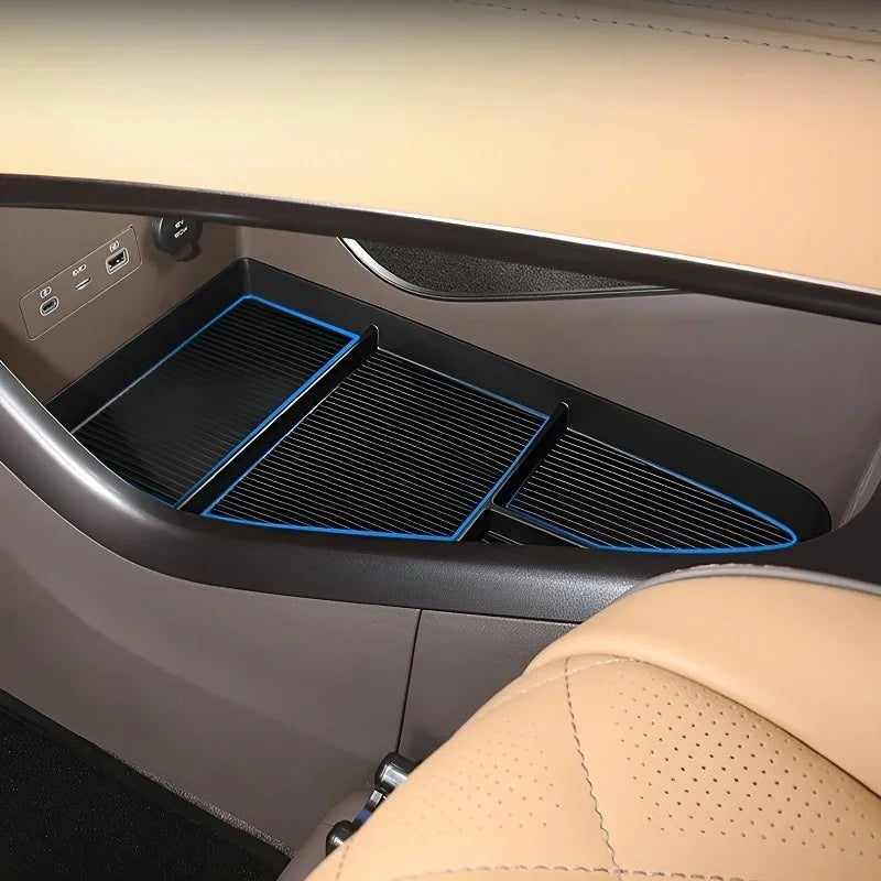 Black textured anti-slip center console organizer tray with blue trim for BYD interior.