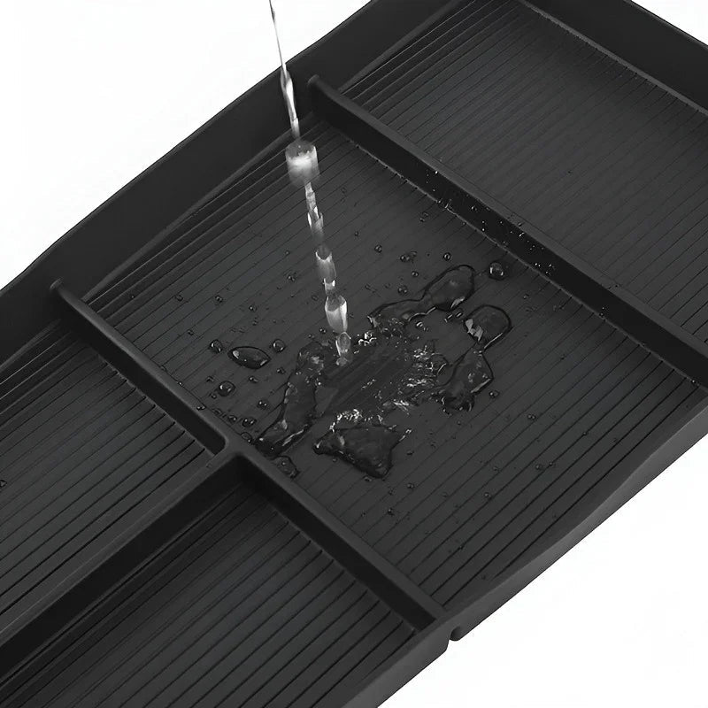 Waterproof black ribbed rubber car floor tray with liquid-resistant drainage design.