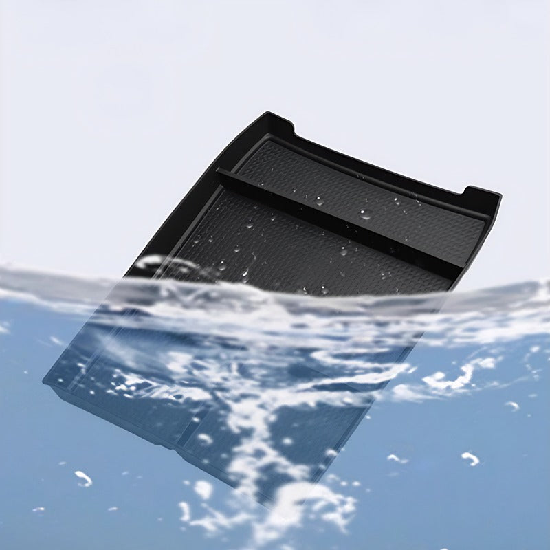 Waterproof black textured car tray accessory partially submerged in clear water.