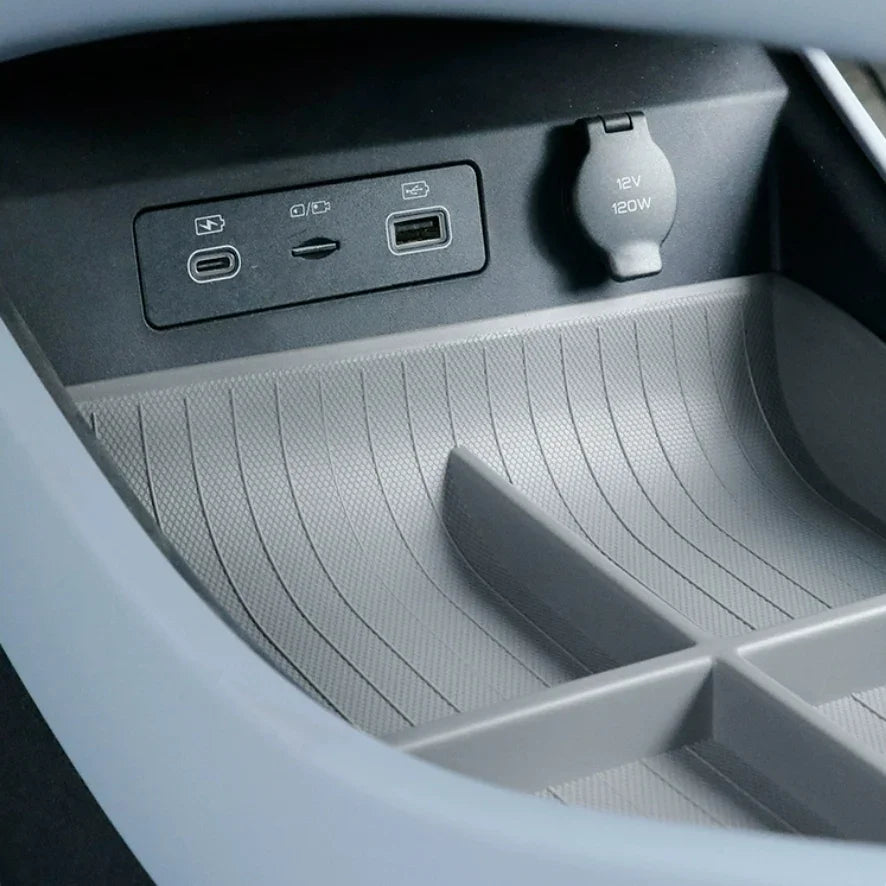 Gray waterproof silicone center console organizer tray with integrated USB charging ports.