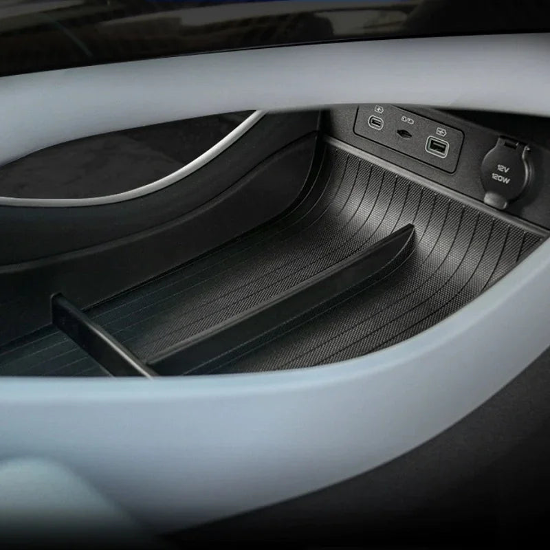 Black textured waterproof silicone center console tray with integrated USB charging ports.