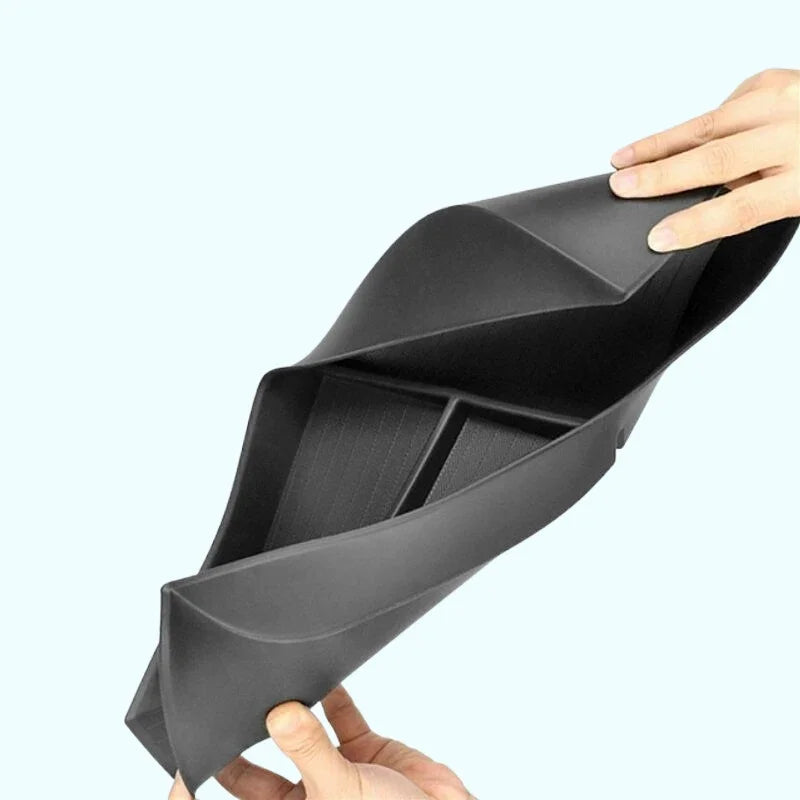Flexible black TPE car organizer tray showing foldable design and durable material