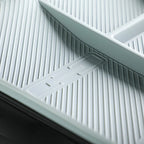 Grey textured TPE car floor mat with anti-slip ridges and integrated drainage design.