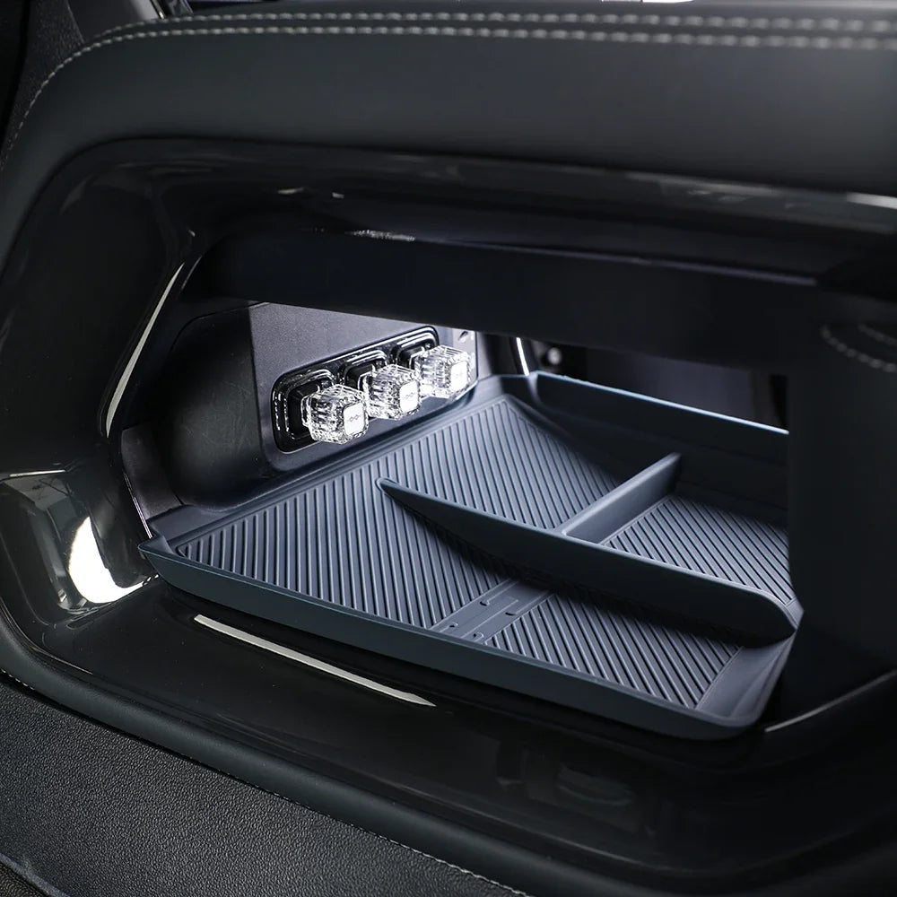 Black rubberized car center console organizer tray with built-in LED lighting for BYD vehicles.