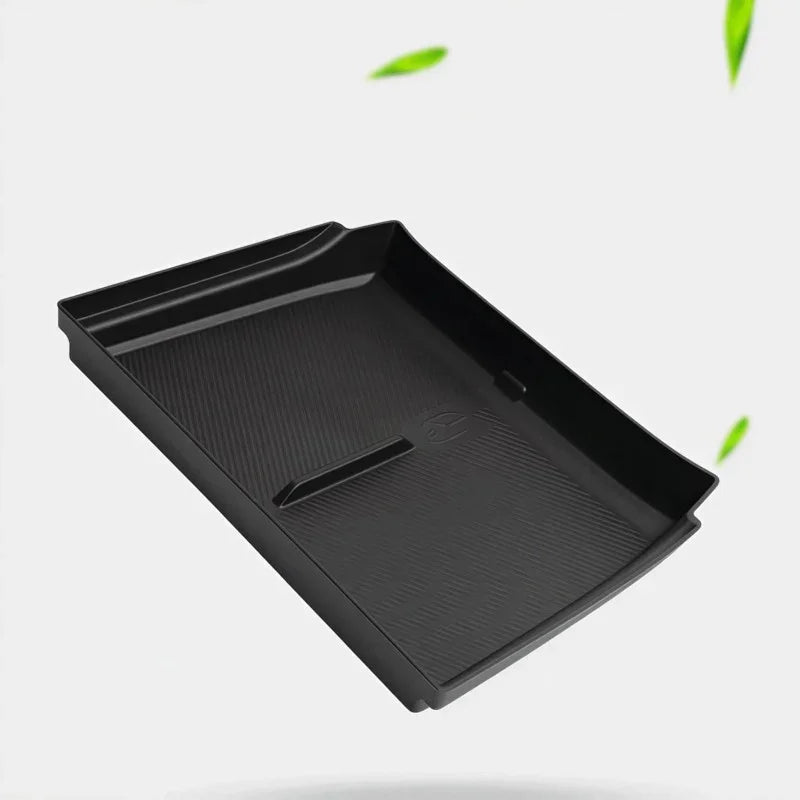 Black textured TPE car center console tray for custom fit and spill protection.