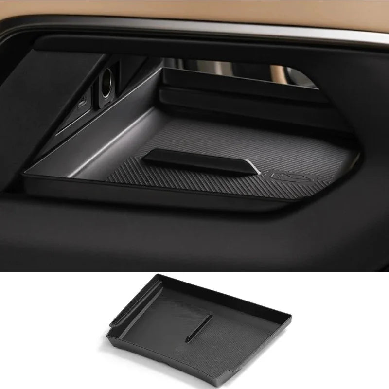 Black textured ABS plastic door pocket organizer tray for BYD vehicle interior storage.