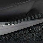 Black premium textured leather car interior trim with precision stitching and sleek finish.
