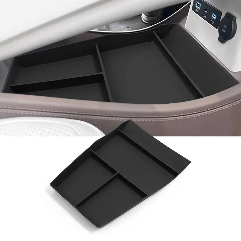 Black matte silicone center console organizer tray for organized car storage.