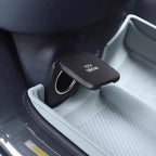 Close-up of a black matte 12V 180W car power outlet with a protective flip cover.