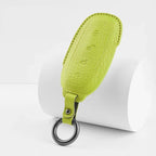 Lime green textured leather car key fob cover with a durable metal ring.