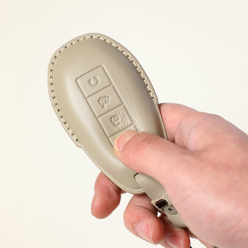 Premium beige leather key fob cover with precise stitching for BYD car keys.