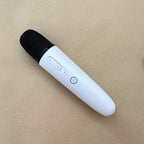 Sleek white wireless handheld microphone with black mesh grille and control buttons.