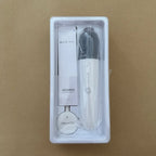 White BYD DiLink wireless karaoke microphone with sleek design in protective packaging.
