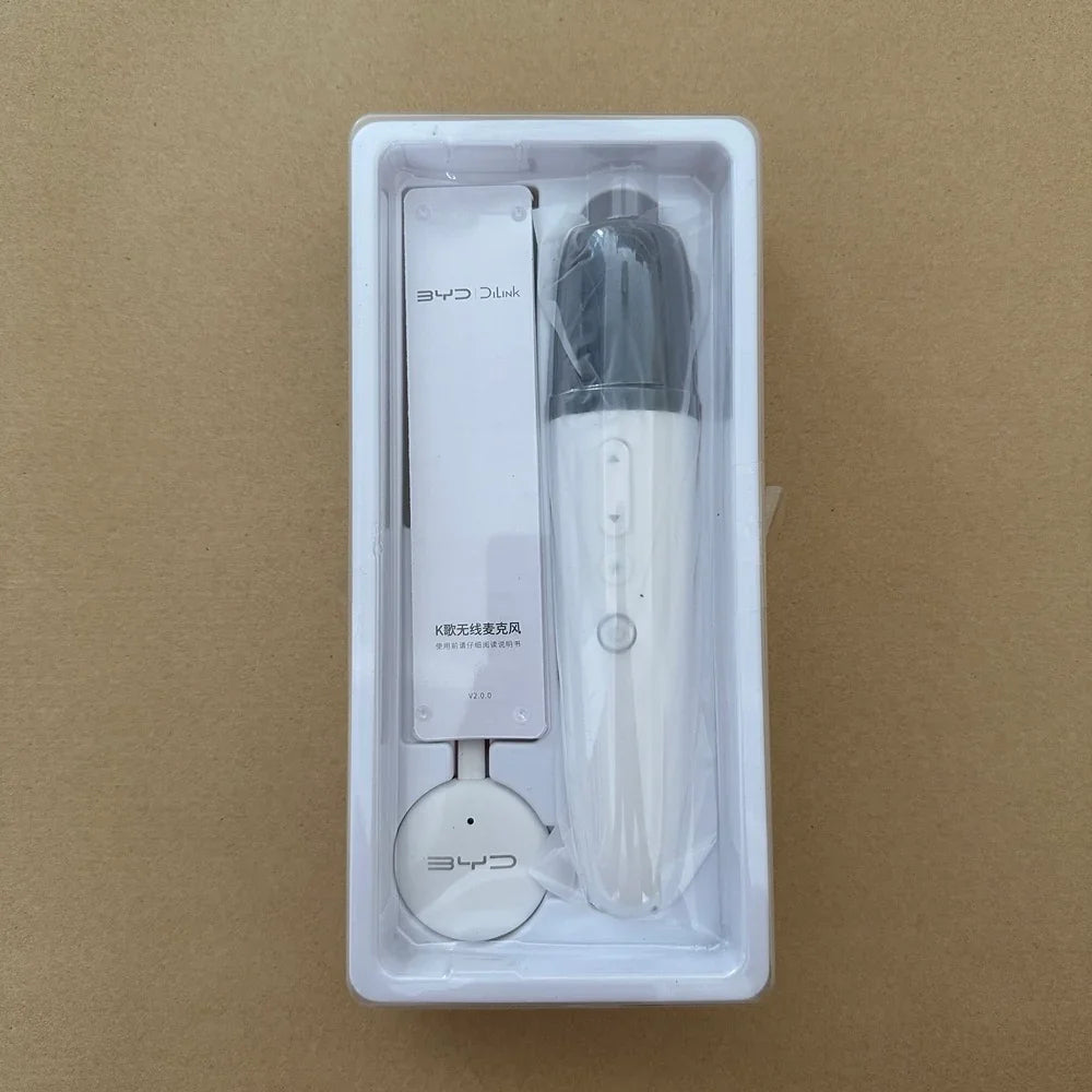 White BYD DiLink wireless karaoke microphone with sleek design in protective packaging.