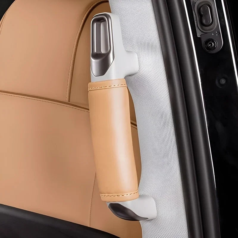 Tan leather wrapped interior grab handle with silver metallic accents for BYD car models.