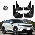 Set of four durable black plastic mud guards with mounting hardware for a white BYD SUV.