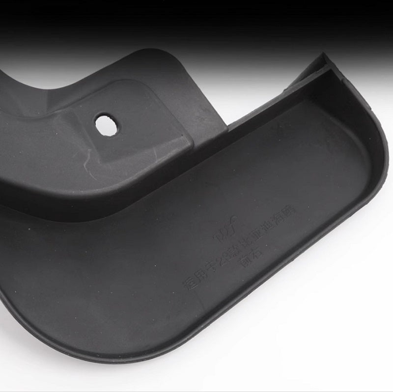 Durable black plastic automotive floor mat accessory with precise molding and textured finish.