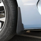 Black durable rubber mud flap installed behind the wheel of a light blue BYD car