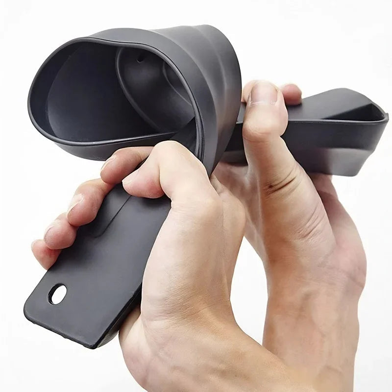 Flexible black matte silicone cup holder extender for car interior protection.