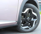 Black durable rubber mud flap installed on a pink BYD car wheel arch for protection.