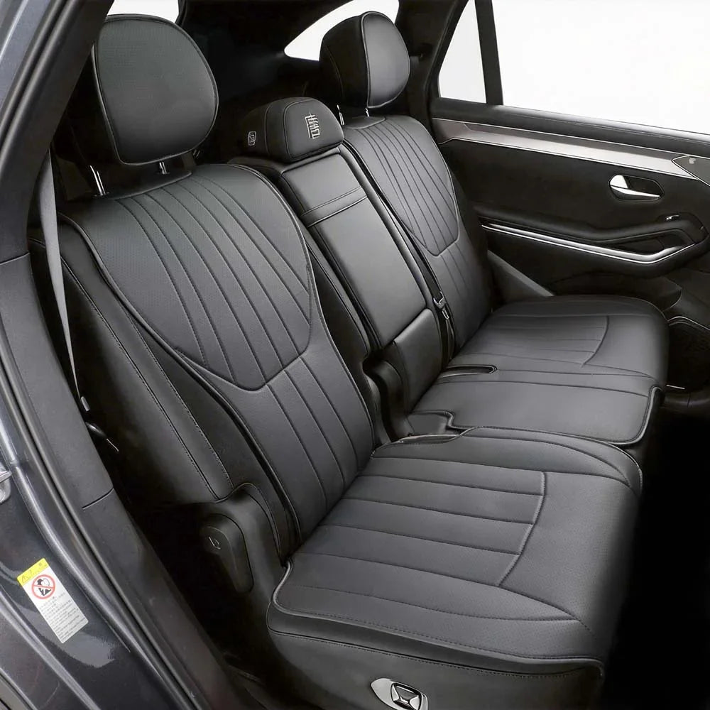 Premium black leather custom car seat covers with elegant ribbed stitching for interior protection.