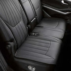 Premium black synthetic leather rear car seat covers with perforated quilted stitching.