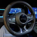 Interior view of a BYD steering wheel featuring a black leather and carbon fiber texture grip.