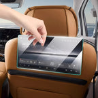 Transparent touchscreen tablet interface attached to a tan leather car seat backrest.