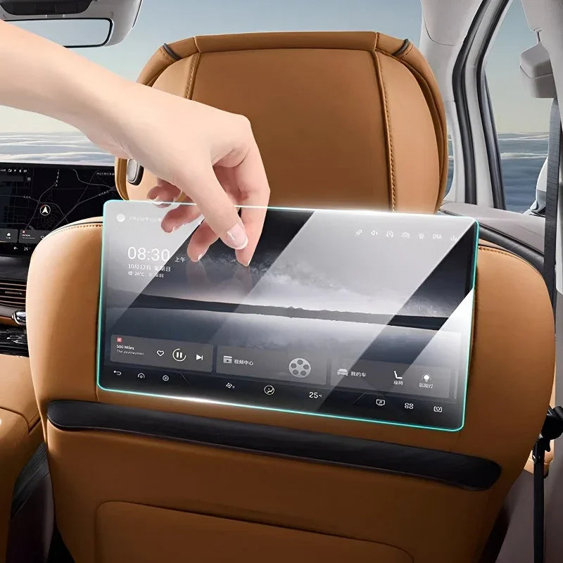 Transparent touchscreen tablet interface attached to a tan leather car seat backrest.