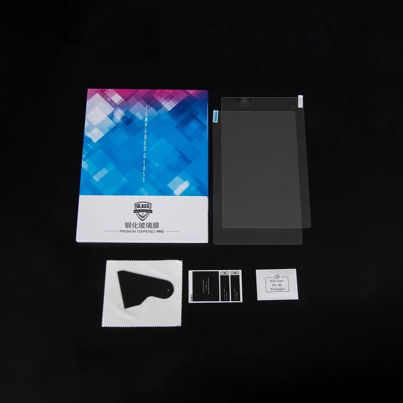 Premium tempered glass screen protector kit with cleaning tools on a black background.