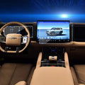 Tan leather car interior featuring a digital dashboard and large touchscreen infotainment display.