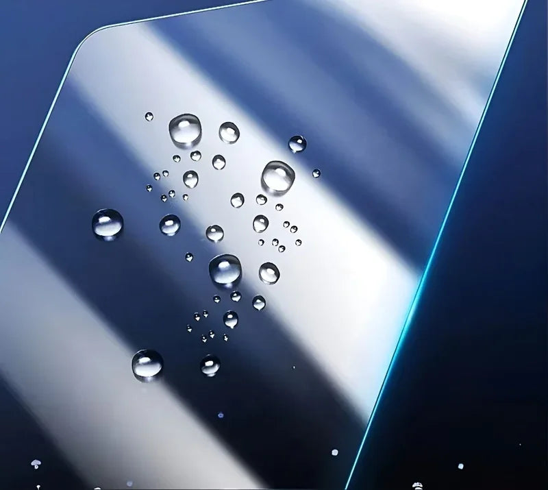 Water droplets beading on a smooth, blue waterproof protective surface material.