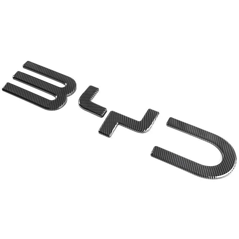 Carbon fiber texture black emblem decals for BYD car exterior styling.