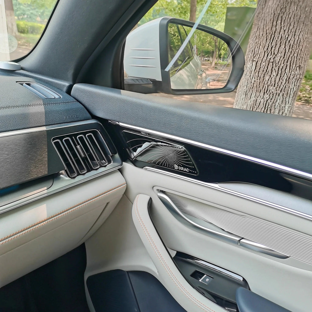 Premium black and white leather car interior featuring a sleek dashboard and silver trim.