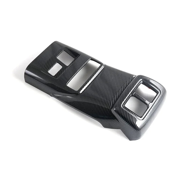 Professional black carbon fiber texture car interior trim panel with precision cut-outs.